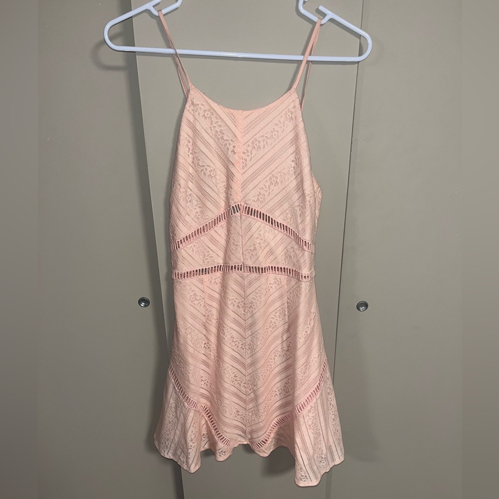 Light pink lace dress with spaghetti straps.